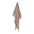 A stylish Jade throw in warm taupe with a boucle pattern and tassels, measuring 130cm x 160cm, to decorate your bed or sofa.