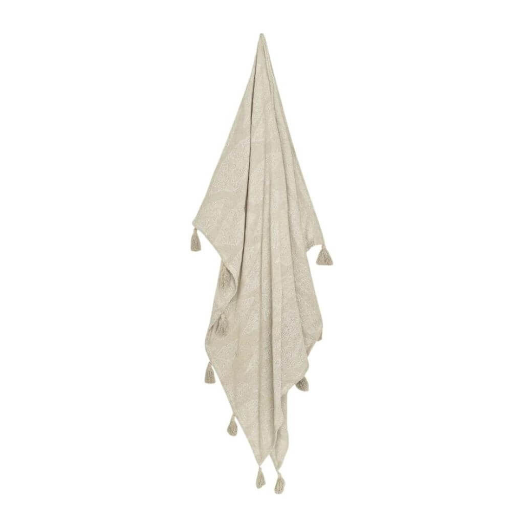 The beautiful Kye Cotton Throw in cream and ivory white with a leaf pattern on both sides and tassles, measures 130cmx 160cm to style your bed or sofa.