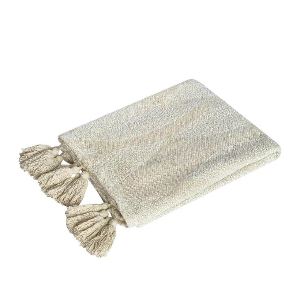 The Kye Cream & Ivory Cotton Throw with a leaf pattern on both sides, measures 130cmx 160cm to style your bed or sofa.
