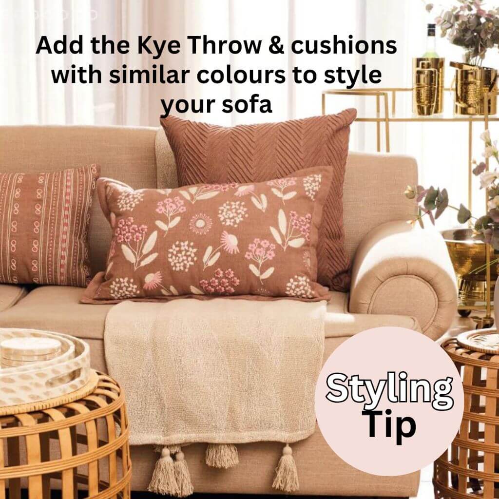The gorgeous Kye Cotton Throw in cream and ivory white with a leaf pattern on both sides, measures 130cmx 160cm to style your living room or bedroom.