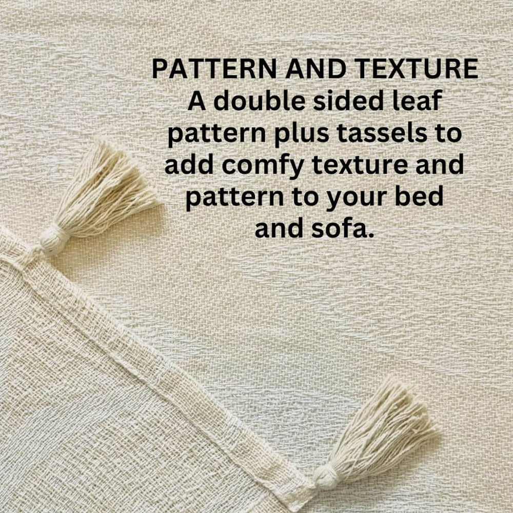 The Kye Cream & Ivory Cotton Throw with a leaf pattern on both sides and tassels, measures 130cmx 160cm to style your bed or sofa.