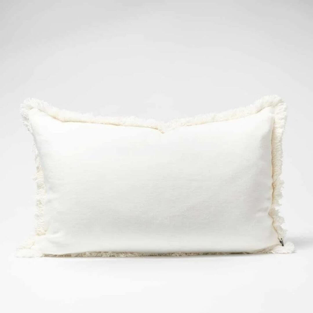 A gorgeous off white Rectangle 40cm x 60cm Luca Boho  Boho Fringe Cushion with cotton fringe edge.