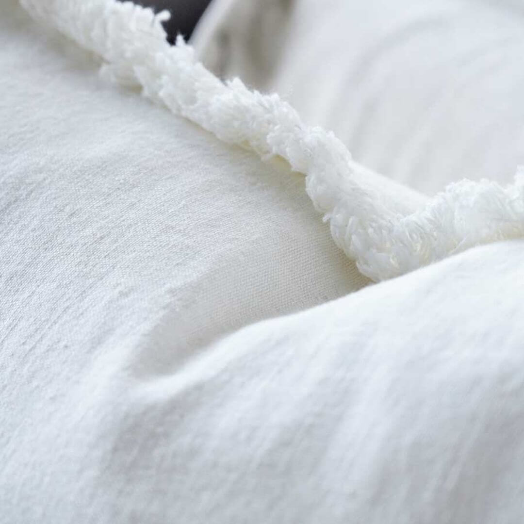 Add casual texture to your home with the Square 50cm Luca Boho Fringe Cushion in white