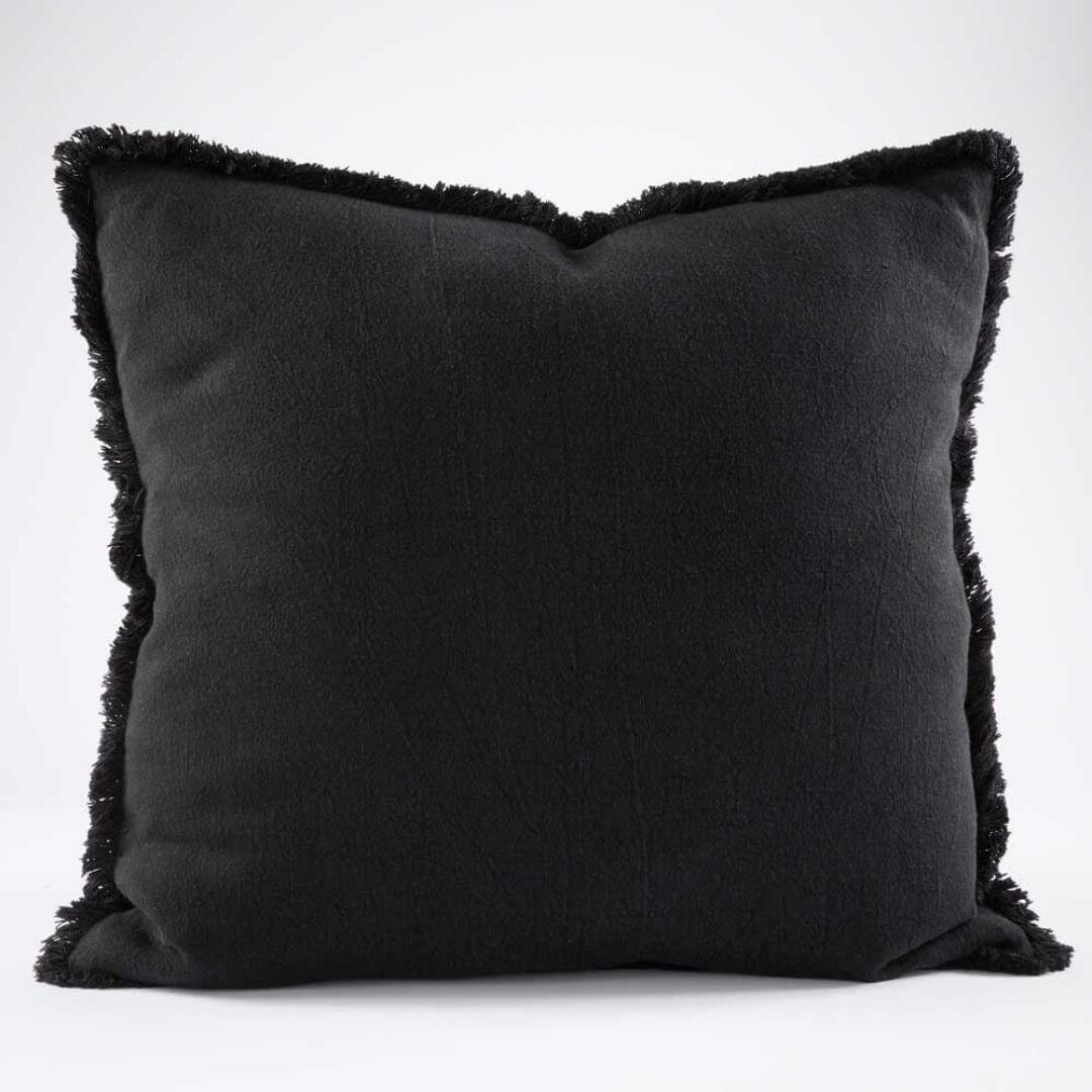 A gorgeous black Square 60cm Luca Boho Fringe Cushion with cotton fringe edge.