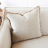 The gorgeous natural colour of the Square 50cm Luca Boho Fringe Cushion on a sofa.