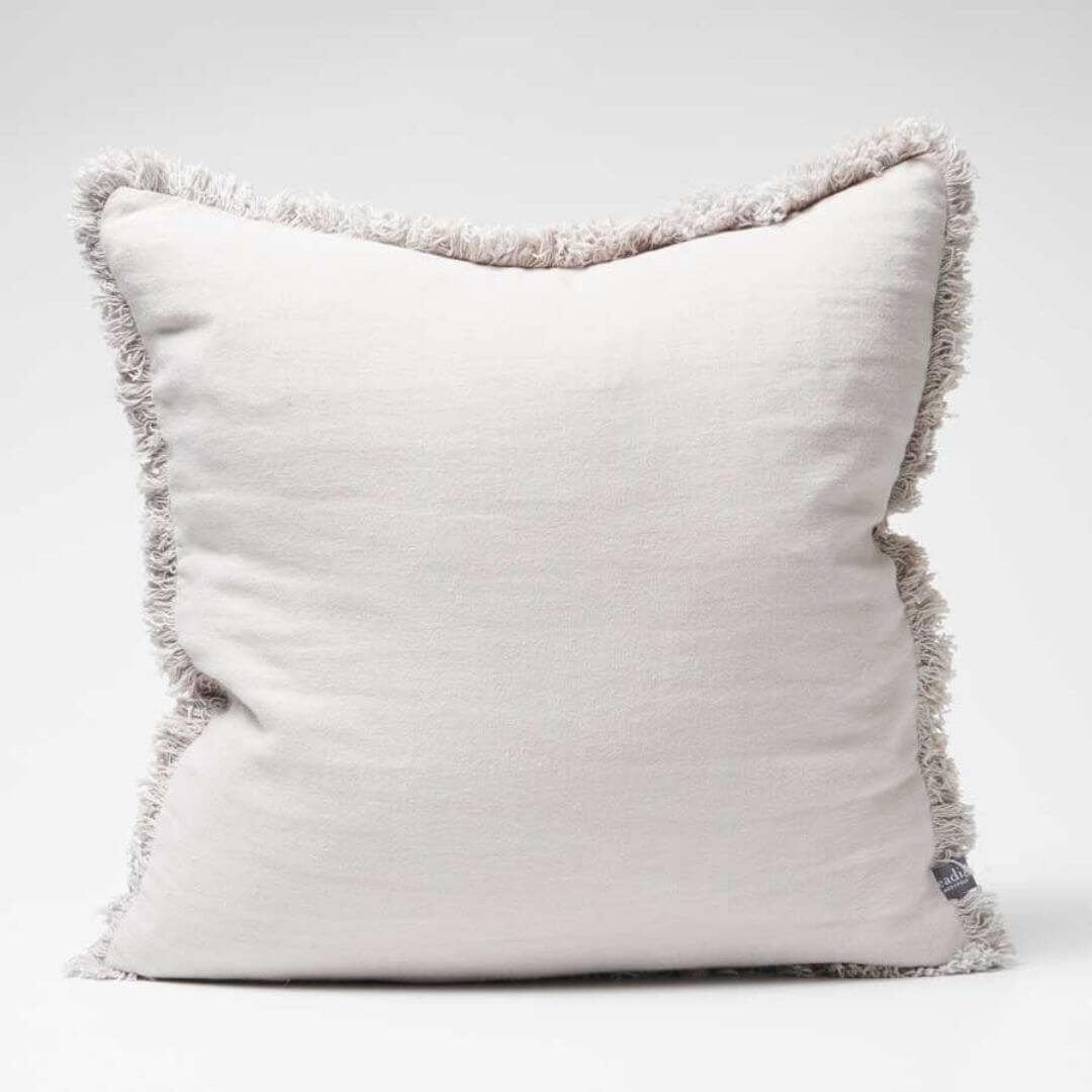 The silver grey Square 50cm Luca Boho Fringe Cushion with cotton fringe edge.