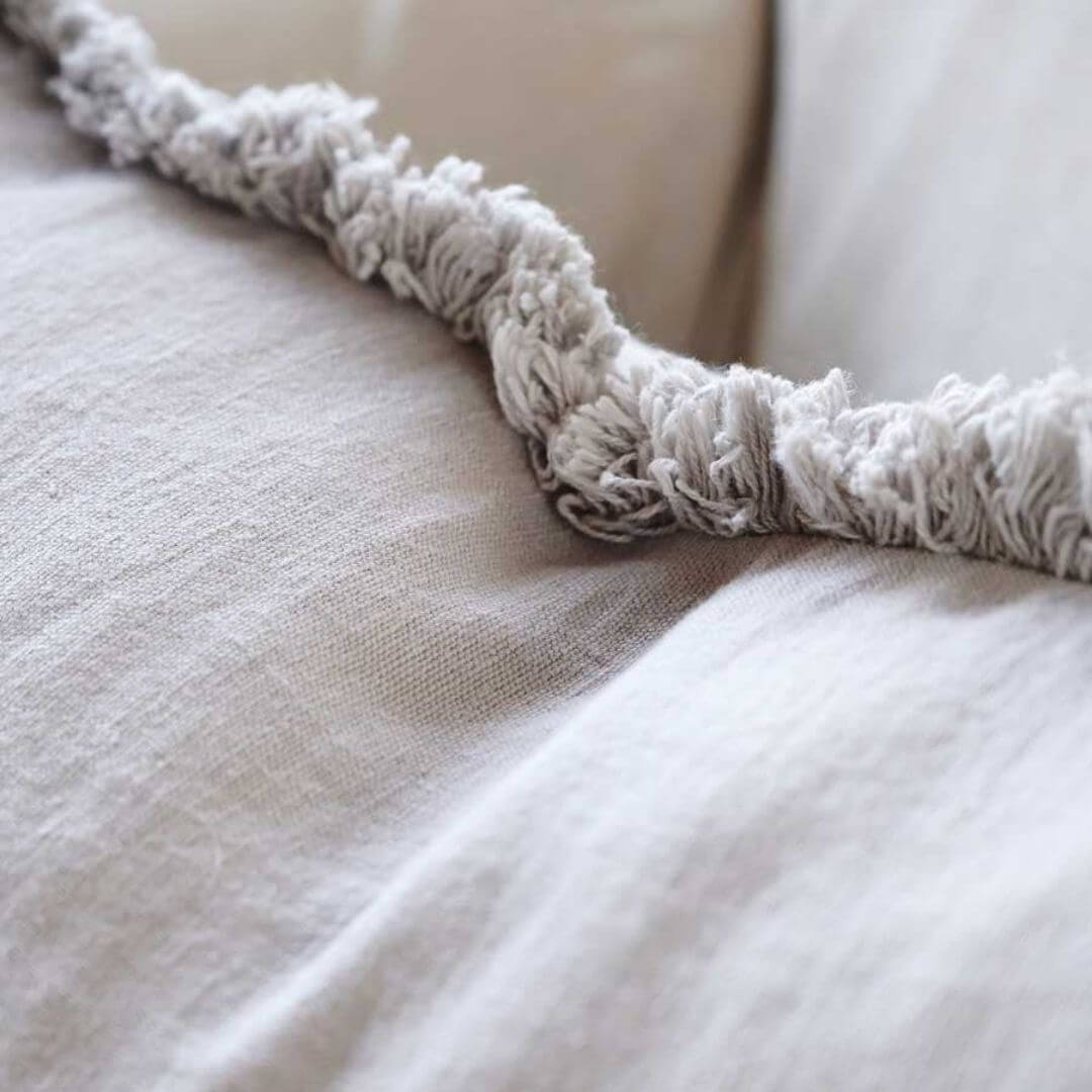 A close up of the edging on the Silver Grey Square 50cm Luca Boho Fringe Cushion
