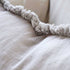 A close up of the edging on the Silver Grey Square 50cm Luca Boho Fringe Cushion