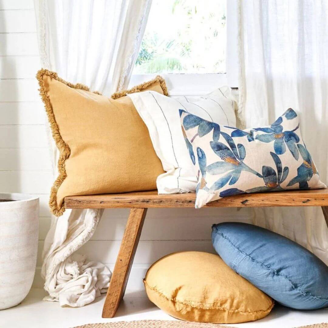 The turmeric yellow Square 50cm Luca Boho Fringe Cushion matches cushions in a variety of colours.