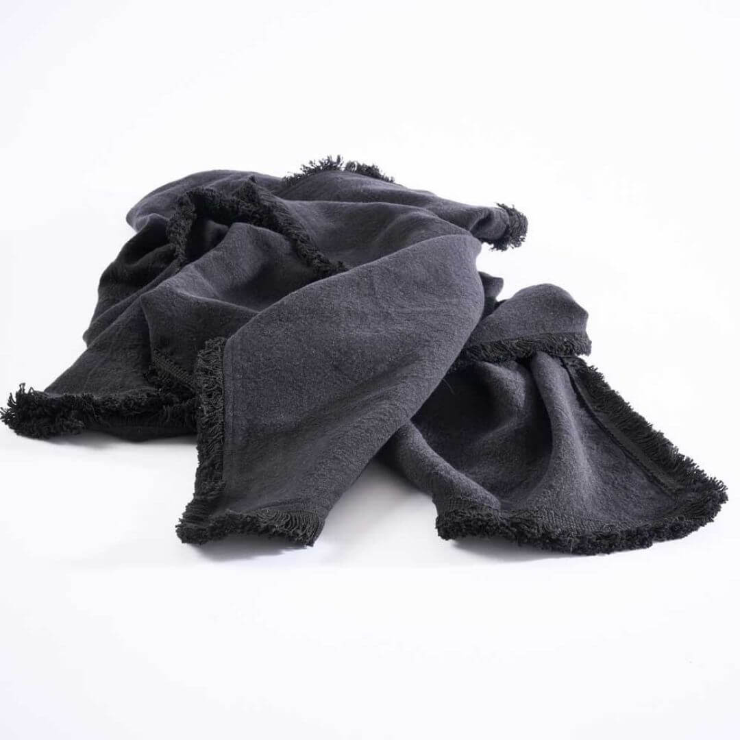 A black Square 60cm Luca Boho Fringe Linen Cushion and throw bundle set to match.