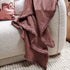A desert rose red throw part of the Rectangle 40cm x 60cm Luca Boho Fringe Linen Cushion and throw bundle set