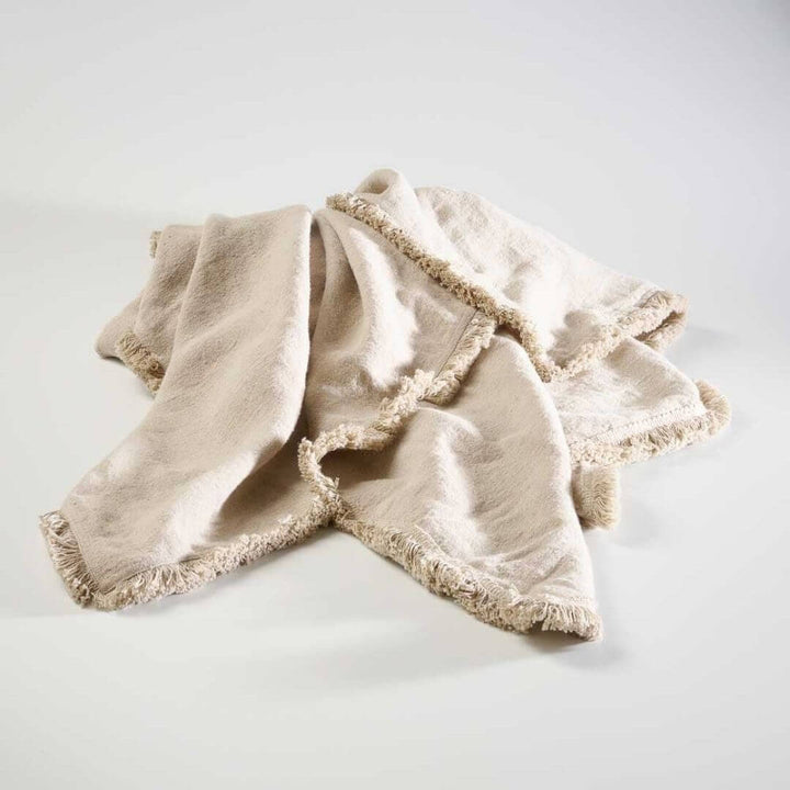 The gorgeous natural tone of the Luca Boho Fringe Linen Throw measuring 150cm x 200 cm 
