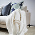 A stylish Off White Square 60cm Luca Boho Fringe Linen Cushion and throw bundle set for your Hamptons Coastal Home Decor.
