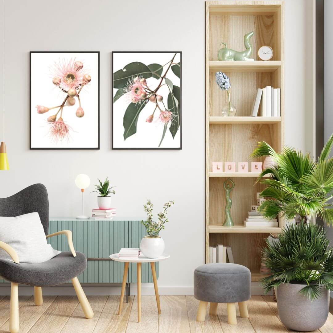 A set of two wall art prints of pink eucalyptus wild flowers with green leaves with a  neutral background. 