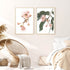 An artwork set of two wall art prints of pink eucalyptus wild flowers with green leaves with a  neutral background. 