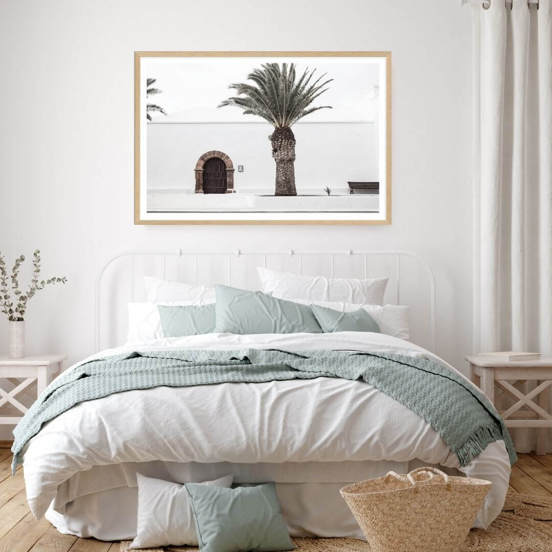 A wall art photo print of a white Spanish Church with a Palm Tree  with a timber frame or unframed to decorate your bedroom walls