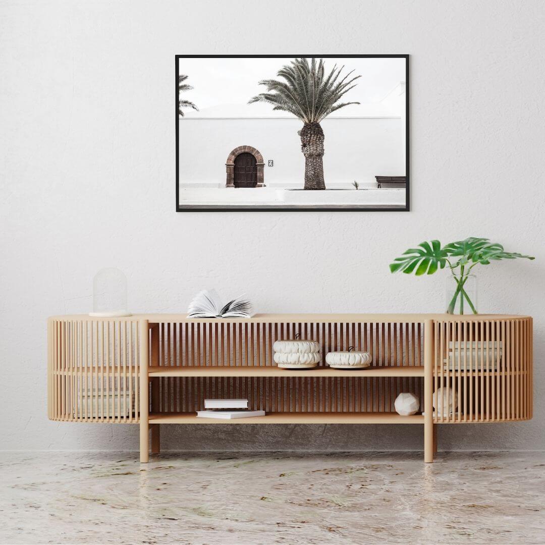 A wall art photo print of a white Spanish Church with a Palm Tree  with a black frame or unframed to decorate a wall above your console table