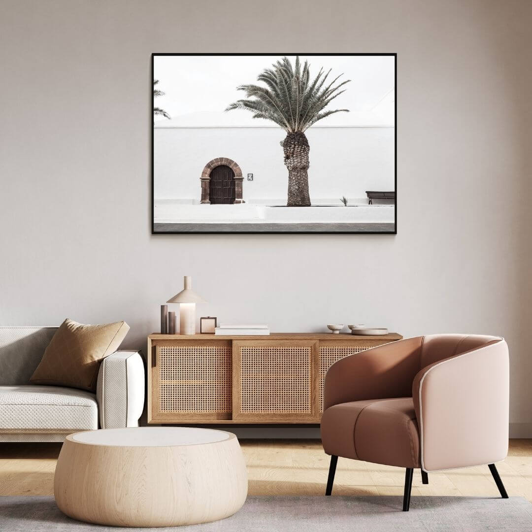 A wall art photo print of a white Spanish Church with a Palm Tree  with a black frame or unframed to decorate a wall in your office