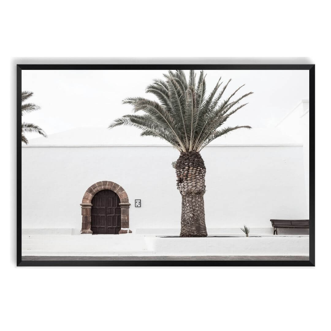 A wall art photo print of a white Spanish Church with a Palm Tree  with a black frame, no white border at Beautiful HomeDecor