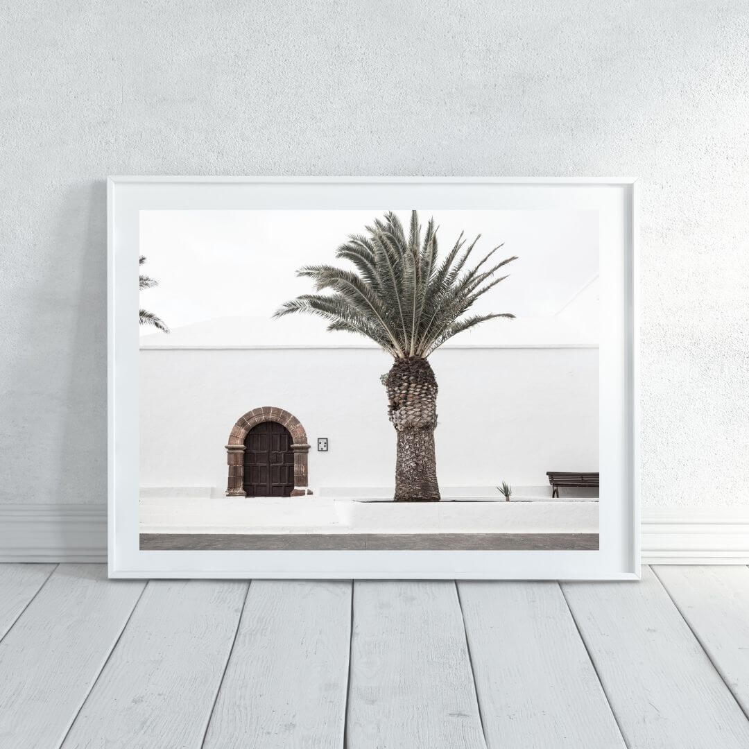 A wall art photo print of a white Spanish Church with a Palm Tree  with a white frame or unframed shop online at Beautiful HomeDecor with free shipping