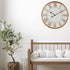 A large 68cm white hamptons roman numerical wall clock with raised timber numerals to style empty walls.
