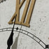 A closep view of the large 68cm white hamptons roman numerical wall clock with raised timber numerals.