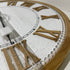 A stylish large 68cm white hamptons roman numerical wall clock with raised timber numerals.