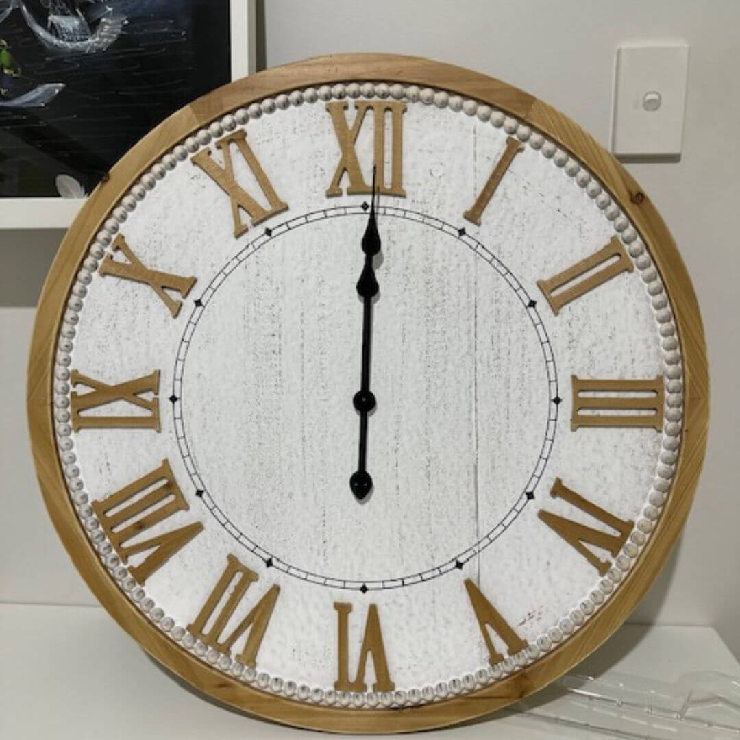 A large 68cm white hamptons roman numerical wall clock with raised timber numerals to decorate your home.