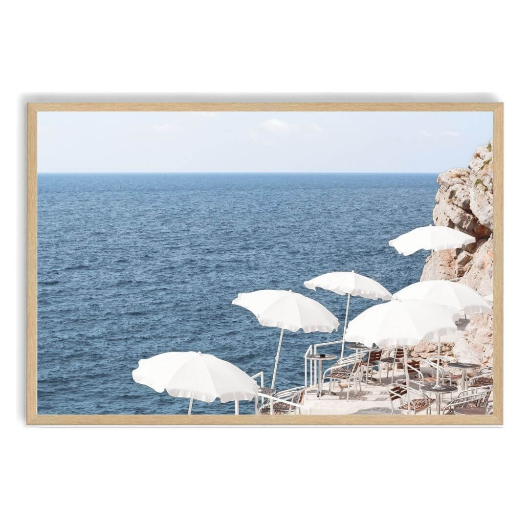 A wall art photo print of white umbrellas on an Amalffi Coast Beach Italy with a timber frame, no white border at Beautiful HomeDecor