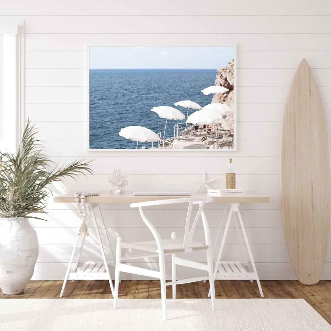 A wall art photo print of white umbrellas on an Amalffi Coast Beach Italy with a white frame or unframed to decorate an empty wall