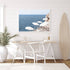 A coastal wall art photo print of white umbrellas on an Amalfi Coast Beach Italy with a white frame or unframed to decorate an empty wall