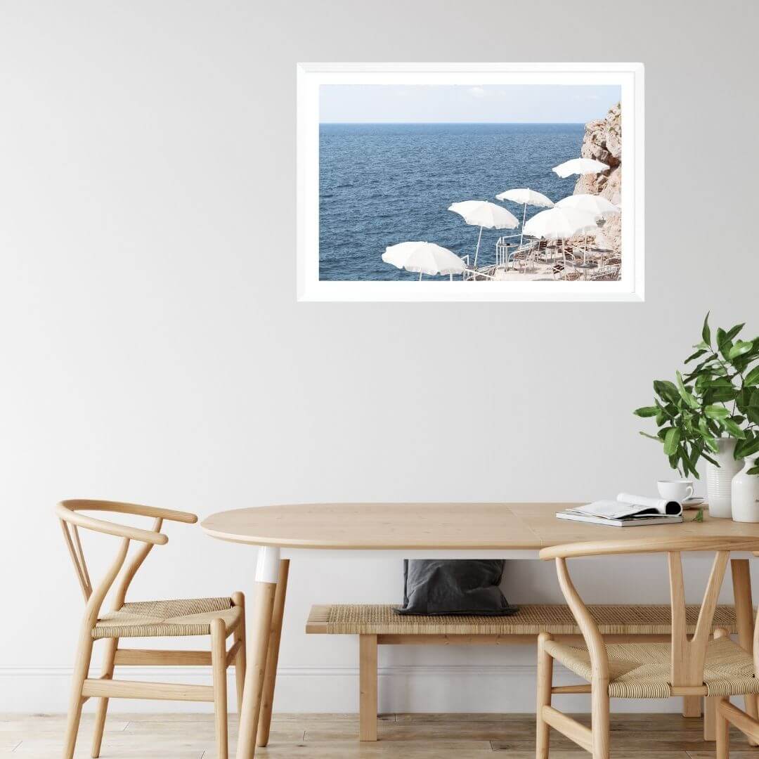 A wall art photo print of white umbrellas on an Amalffi Coast Beach Italy with a white frame or unframed to style your dining room
