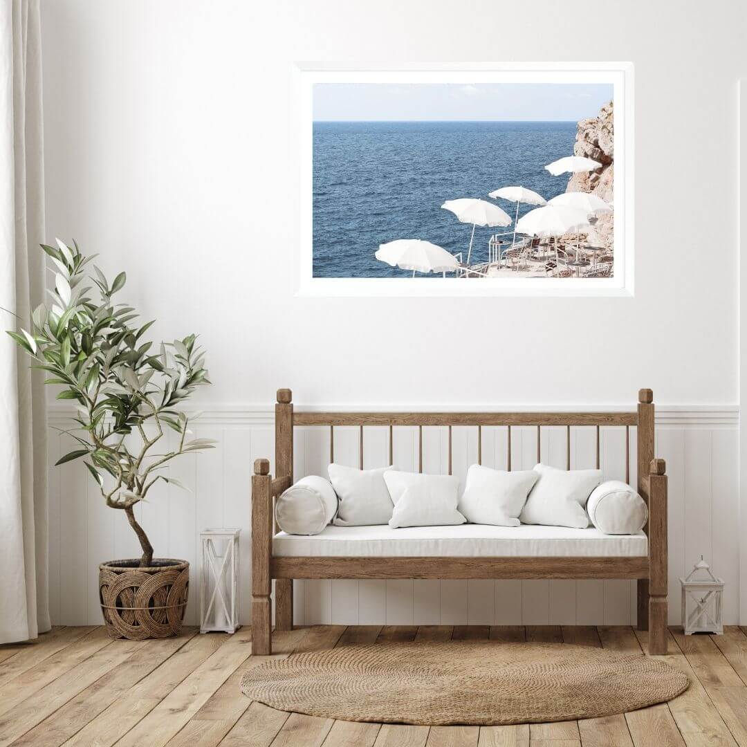A wall art photo print of white umbrellas on an Amalffi Coast Beach Italy with a white frame for the hallway wall with free shipping