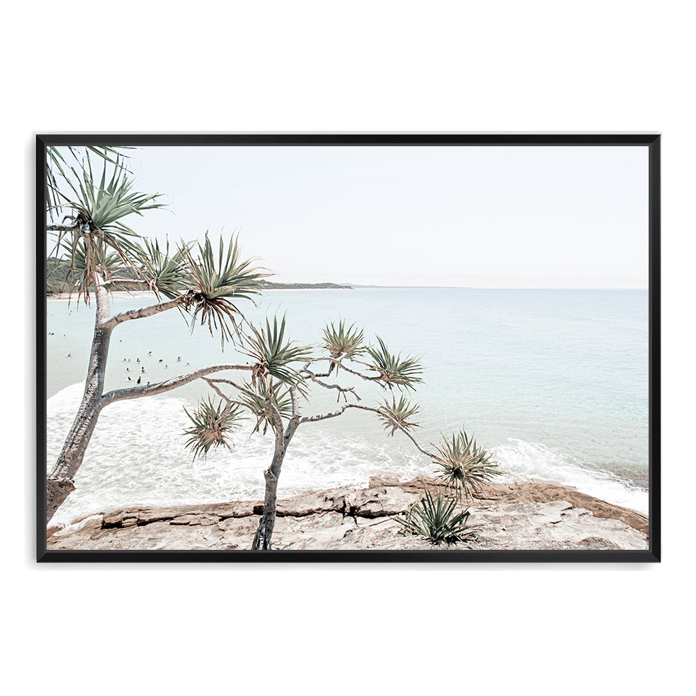 A Hamptons photographic artprint of Byron Bay's Watego Beach featuring surfers in the blue waves, available framed on unframed. 