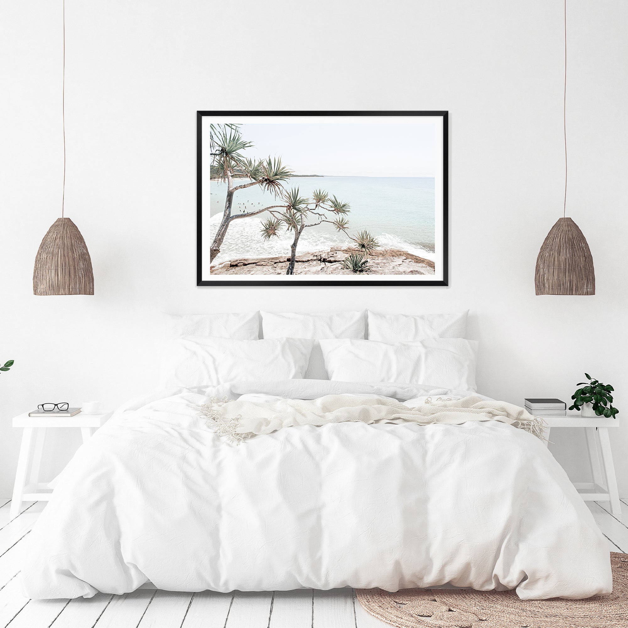 Featuring a photo wall art print of Byron Bay's Watego Beach with surfers in the blue waves, available framed on unframed. 