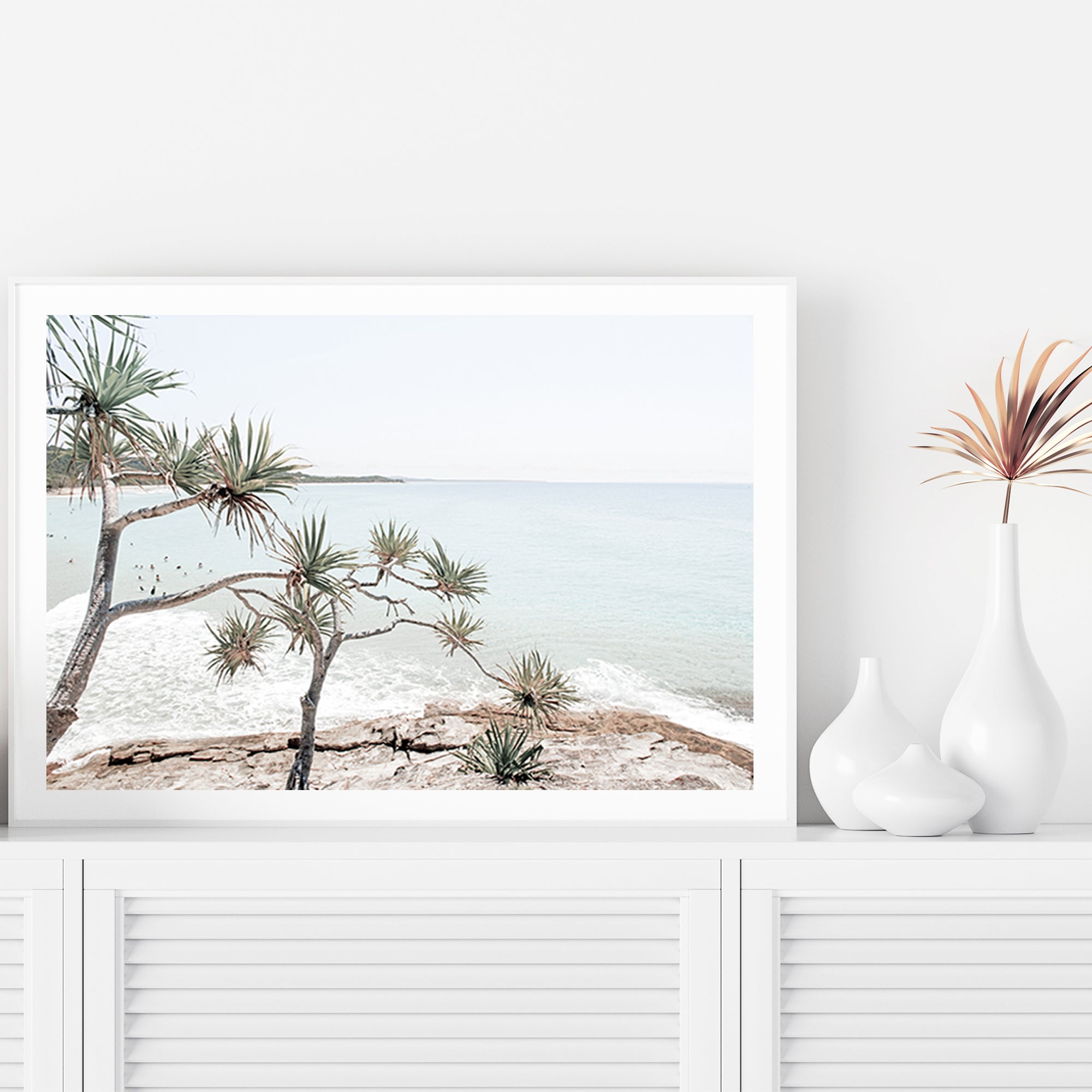 A Hamptons photographic stretched canvas  artprint of Byron Bay's Watego Beach featuring surfers in the blue waves, available framed on unframed of Australian Surf Beach A.