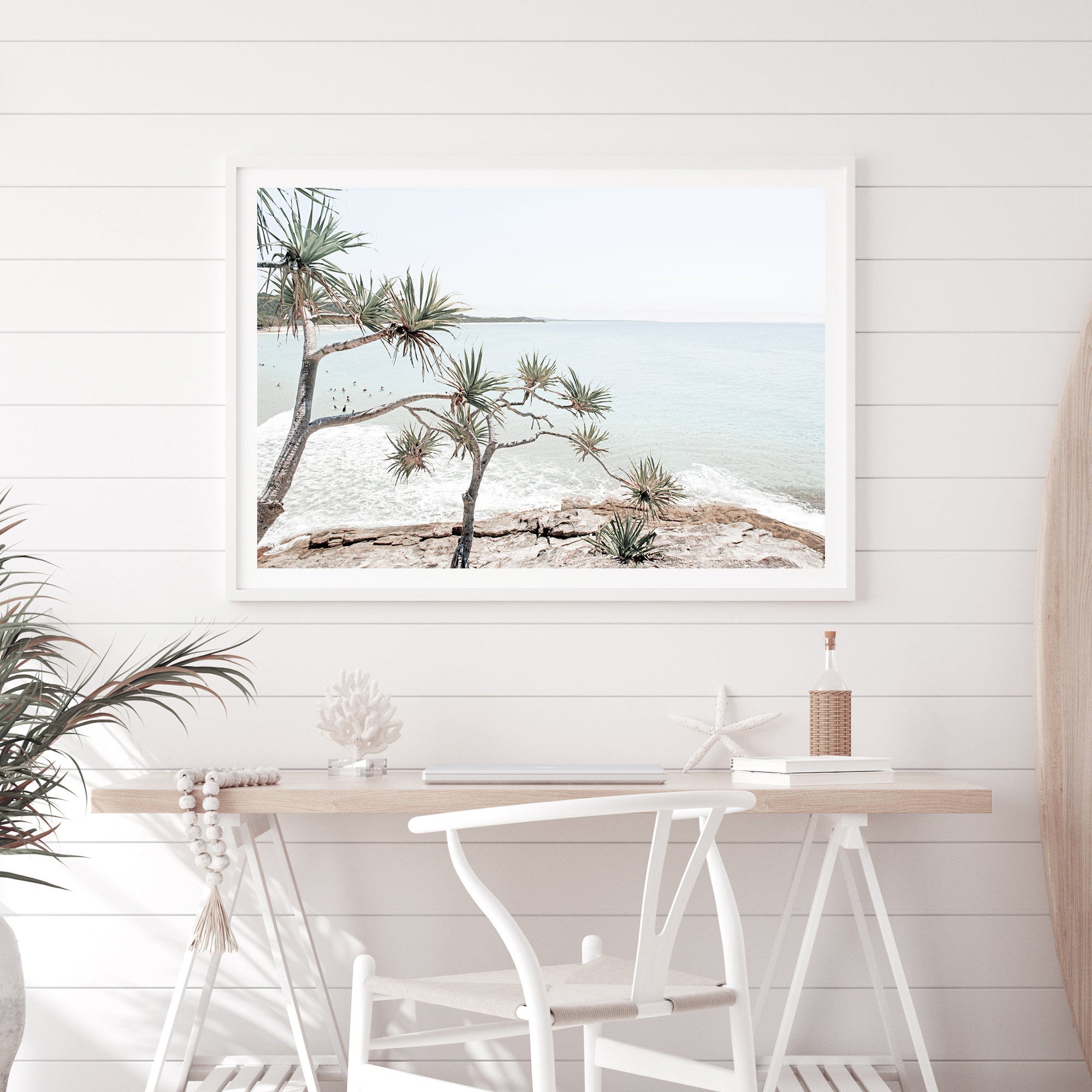 A coastal photographic stretched canvas artprint of Byron Bay's Watego Beach featuring surfers in the blue waves, available framed on unframed of Australian Surf Beach A.