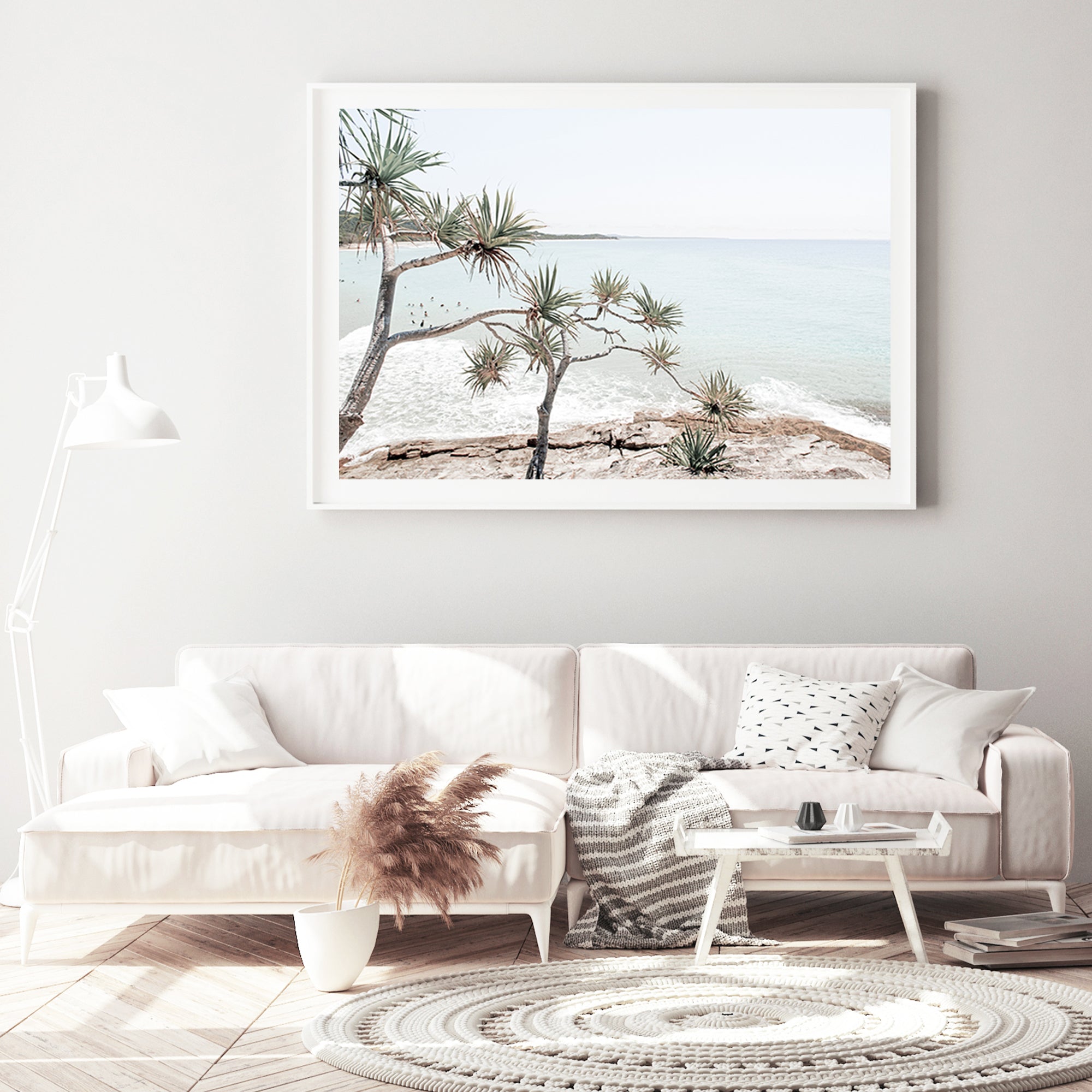 A Hamptons stretched canvas wall art print of Byron Bay's Watego Beach featuring surfers in the blue waves, available with our without a frame of Australian Surf Beach A.