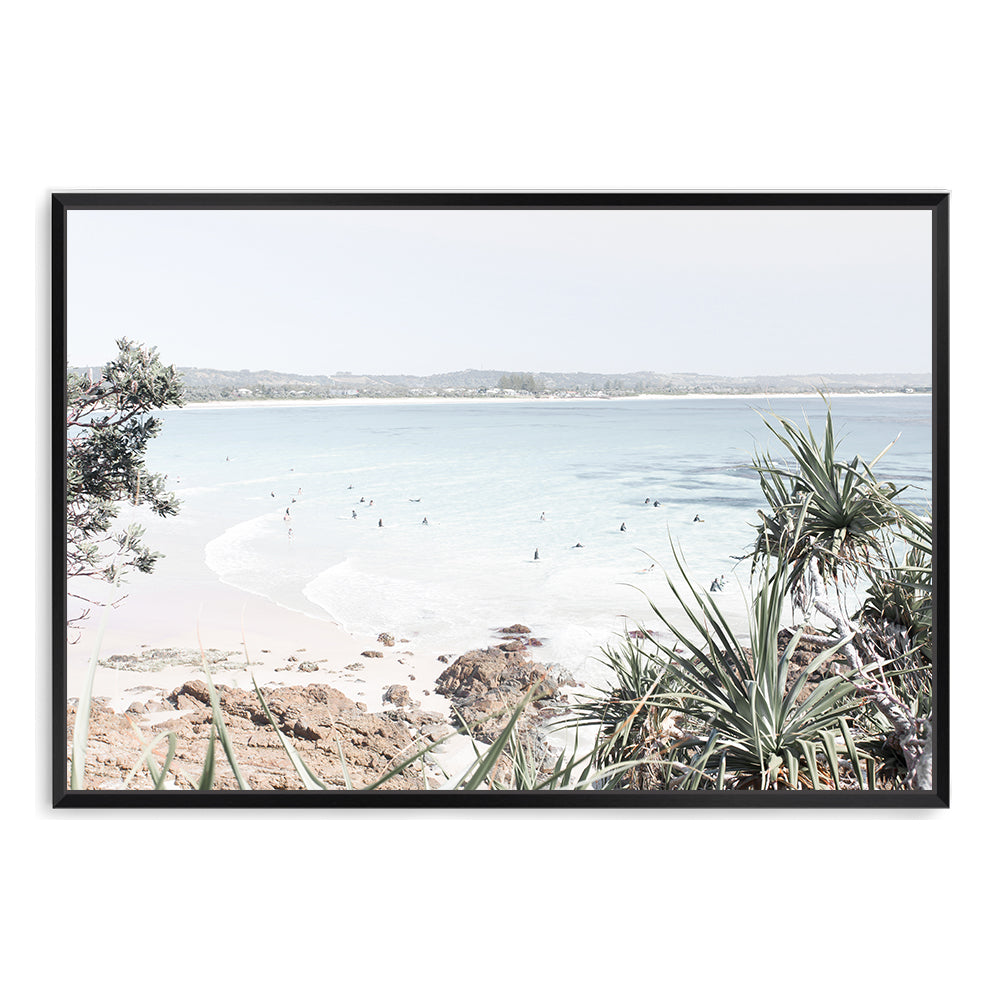 An artprint featuring Watego Beach in Byron Bay with surfers in the blue waves, available in poster prints and canvas prints of Australian Surf Beach B.