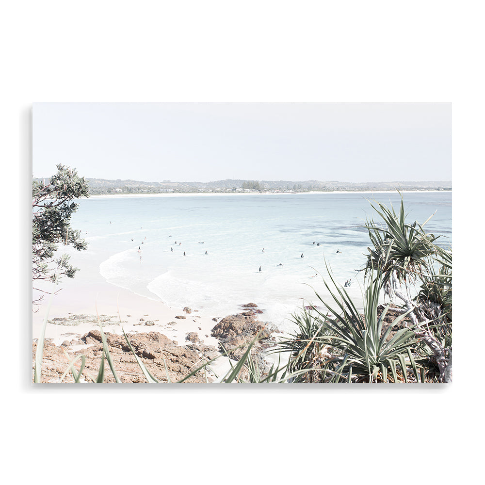 A photographic artprint of Watego Beach in Byron Bay featuring surfers in the blue waves, available framed on unframed of Australian Surf Beach B.