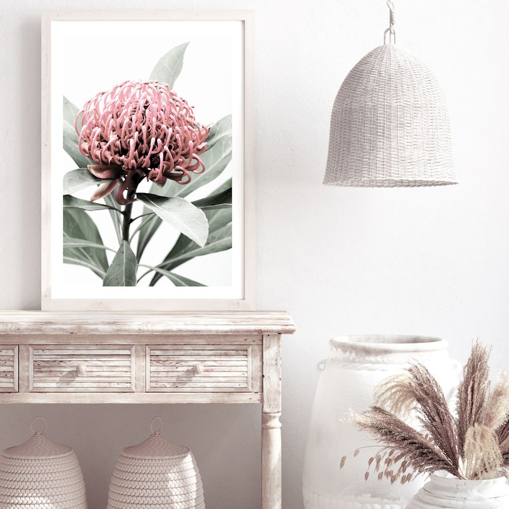 This floral wall art print featuring a beautiful red Australian native waratah flower A and muted green leaves in the background is available in canvas and photo prints.