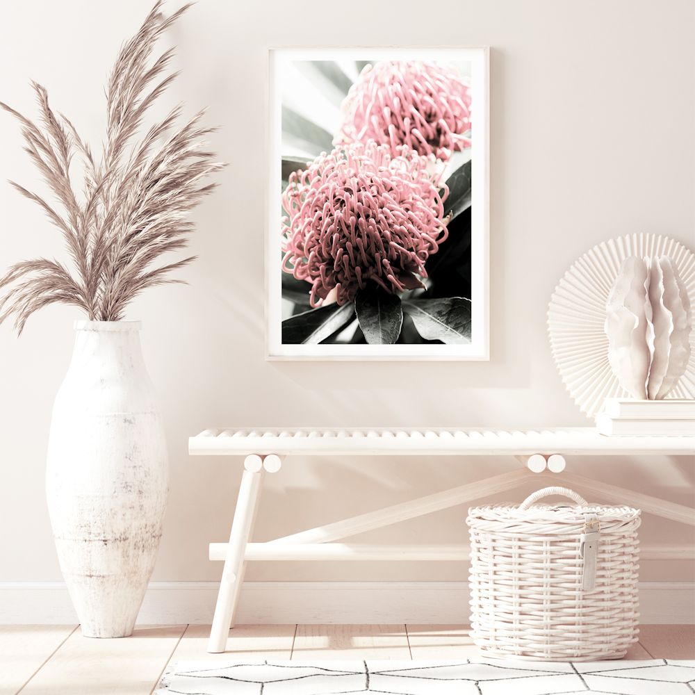 A beautiful floral artwork featuring two red Australian native Waratah flowers with muted green leaves in the background, available in canvas and art prints.