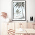 An artwork of a hammock between two palm trees on a tropical beach, available in print and canvas. 