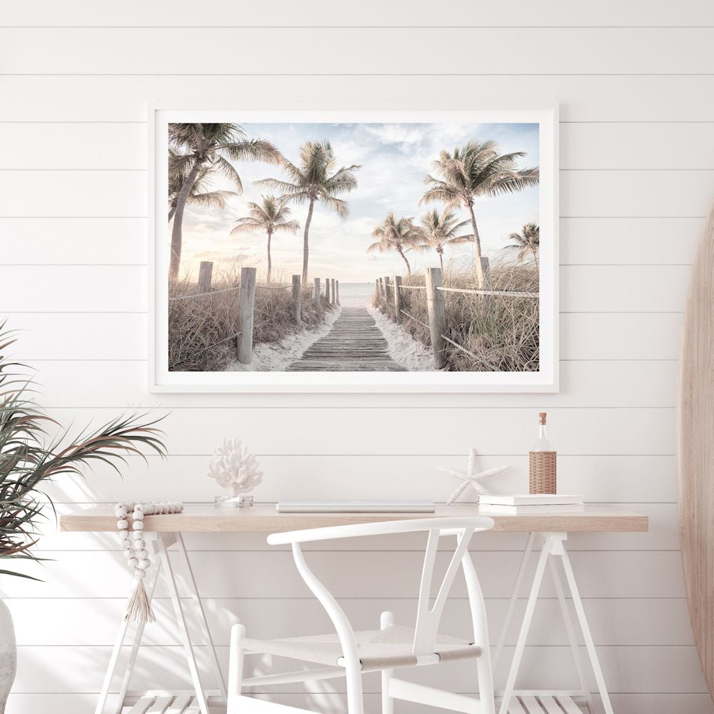 A framed or unframed coastal art print of Florida Keys with a path to the beach framed by palm trees.