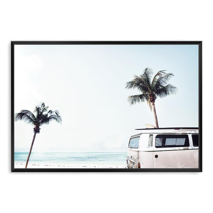 A stretched canvas print featuring an iconic blue Kombi van at the beach with palm trees, available unframed or framed of a beachside kombi van.