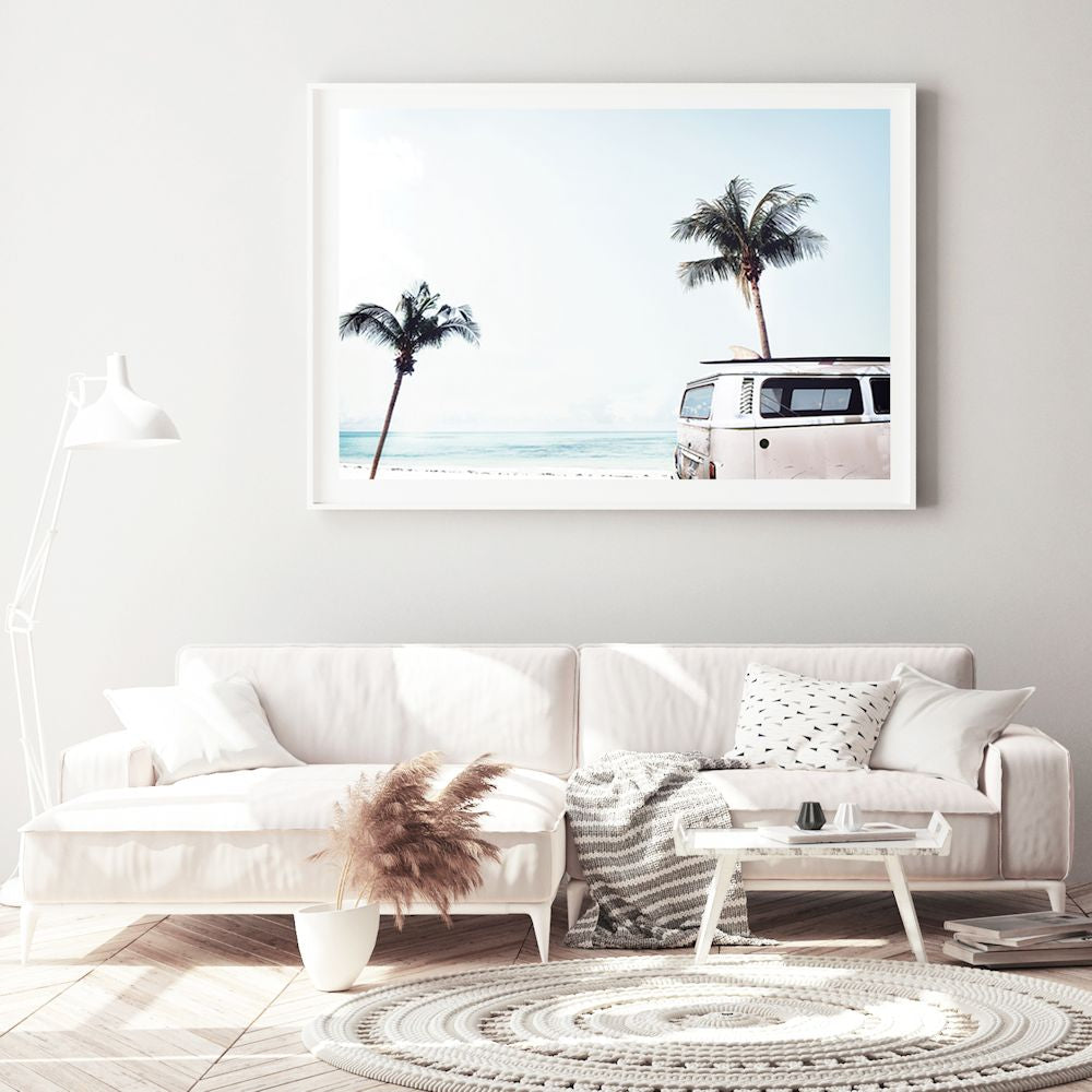Featuring an iconic blue Kombi van at the beach with palm trees available in a photo or canvas artwork.