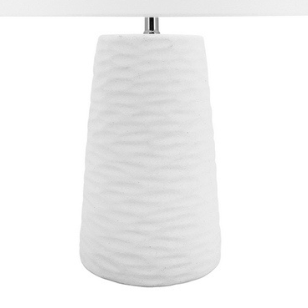 The 62cm tall white Kima Table lamp has a textured wavy base perfect for your coastal hamptons  home decor.