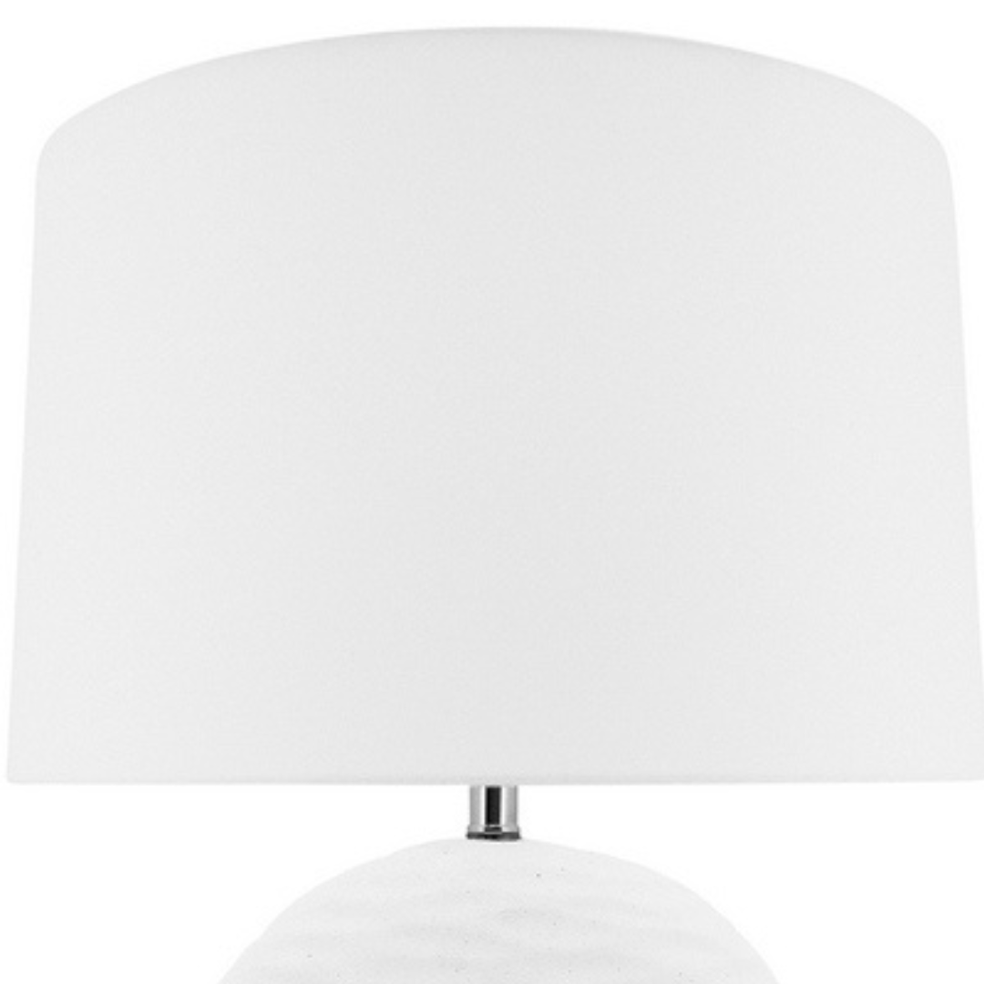 White Round Kima Table with a white lamp shade and textured wavy base measuring 54cm tall for your coastal home decor.
