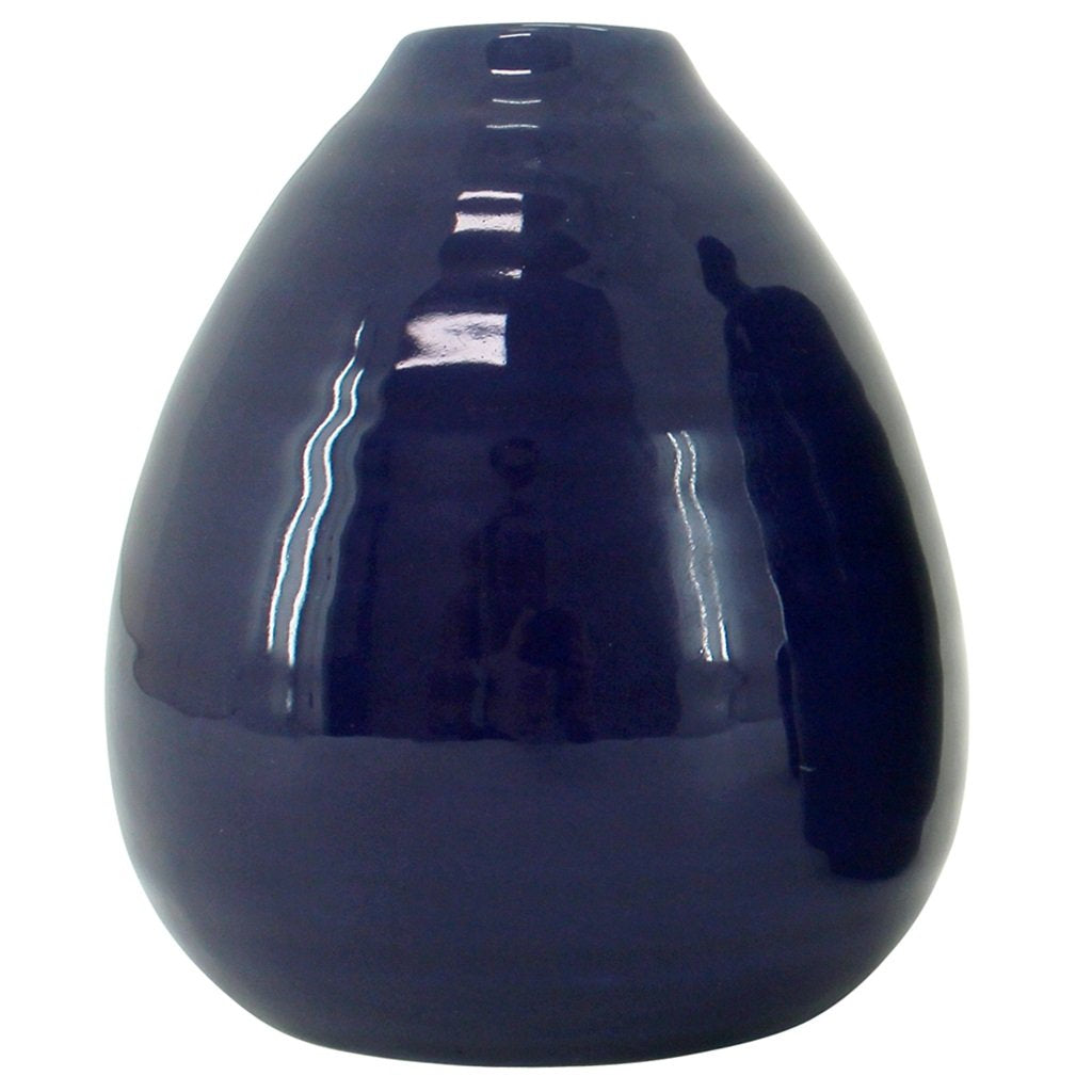 A Medium Bud Vase in Indigo. With a smooth ceramic finish this stylish home decor vase will compliment your living space.