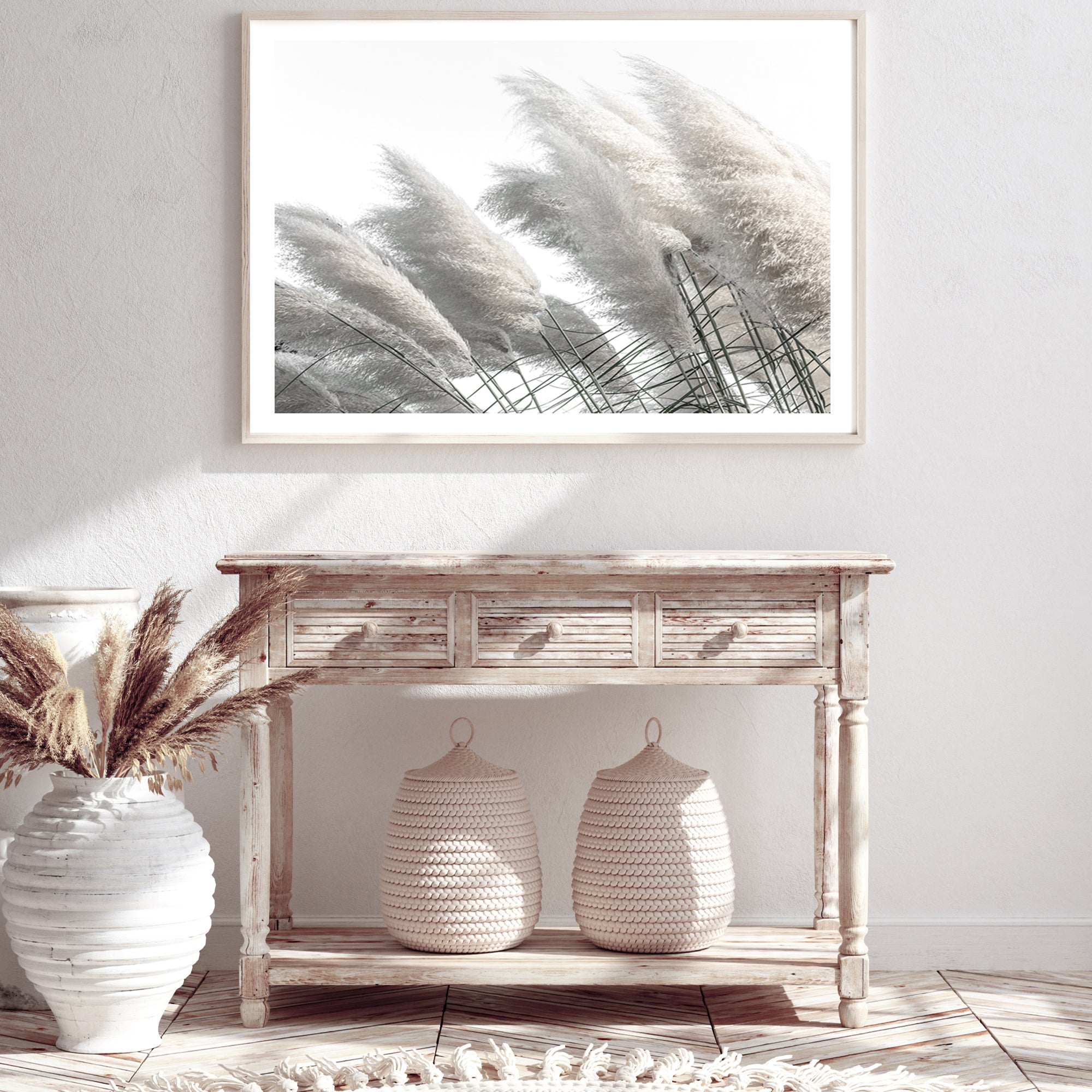 Featuring a stretched canvas coastal wall art print of pampas grass in neutral tones available unframed or framed in timber, black or white frames. 
